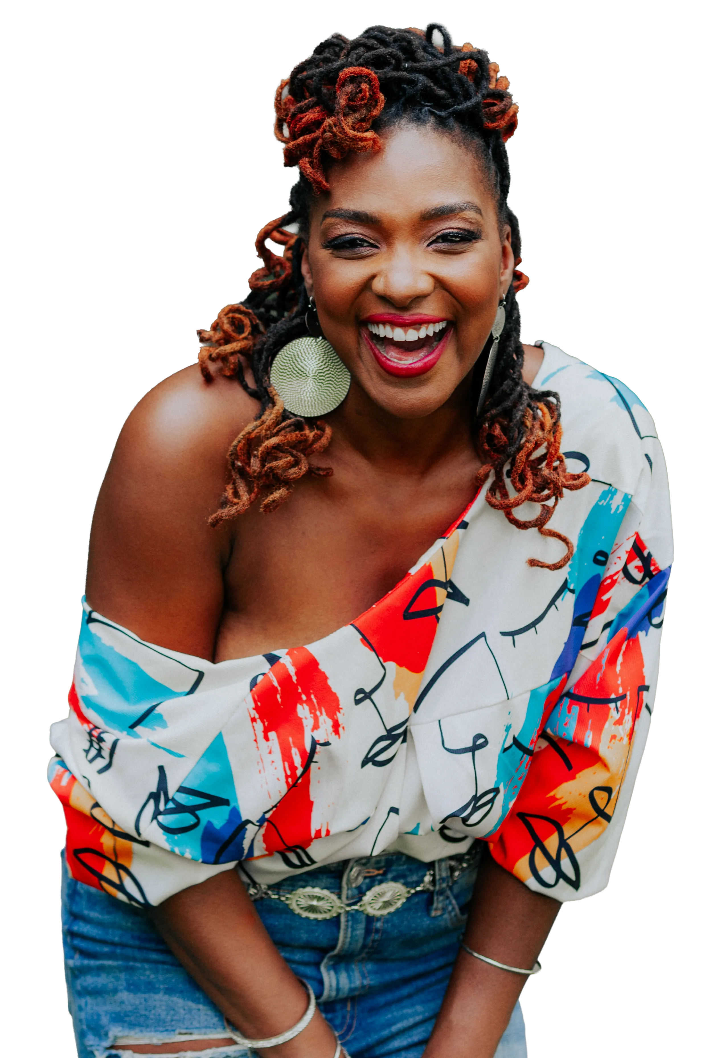 Bella Forté smiling in a colorful patterned blouse